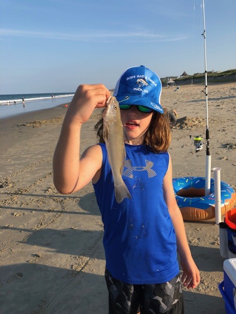 Micah catching sea mullet on OBX surf.
