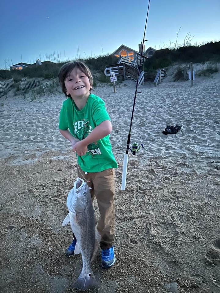 Owen with a red drum Duck surf.